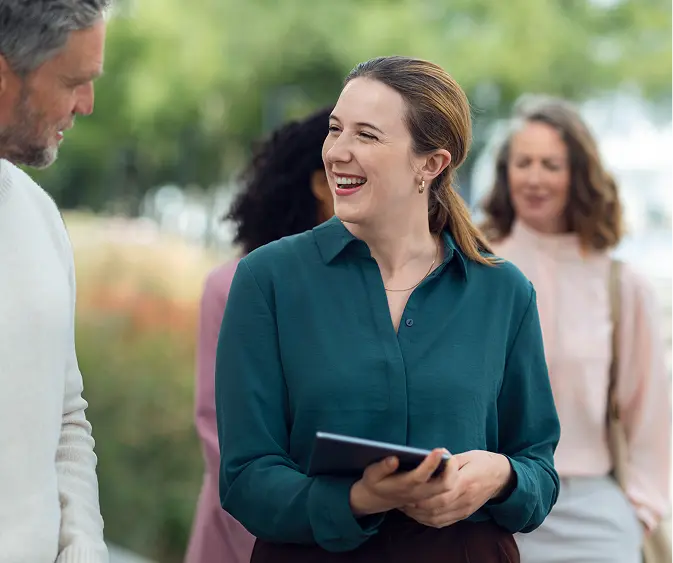 Team members discussing ESG progress outdoors